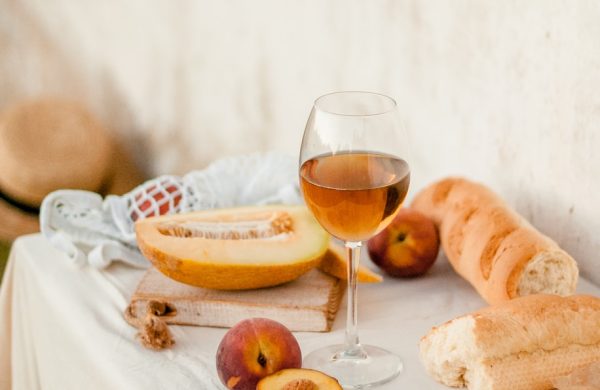 bread and wine glass on table